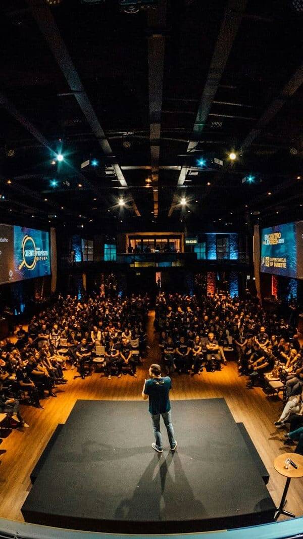 people sitting on chairs watching a game