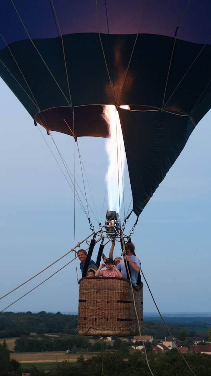 a group of people in a hot air balloon